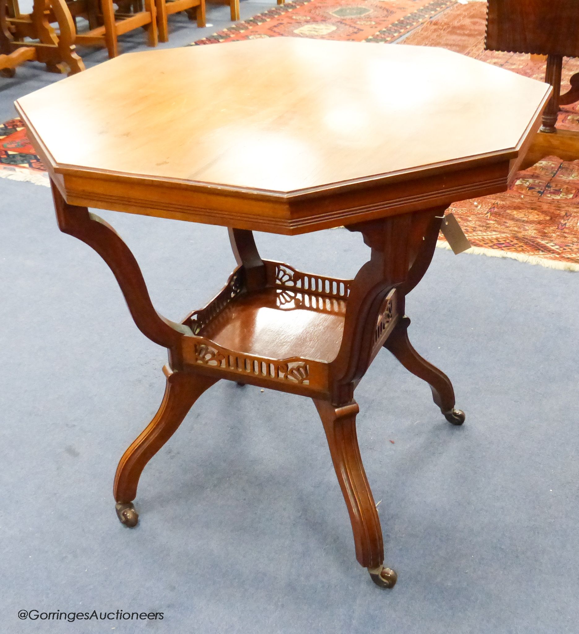 A Late Victorian walnut octagonal centre table, 75.5 cm wide, 69 cm high